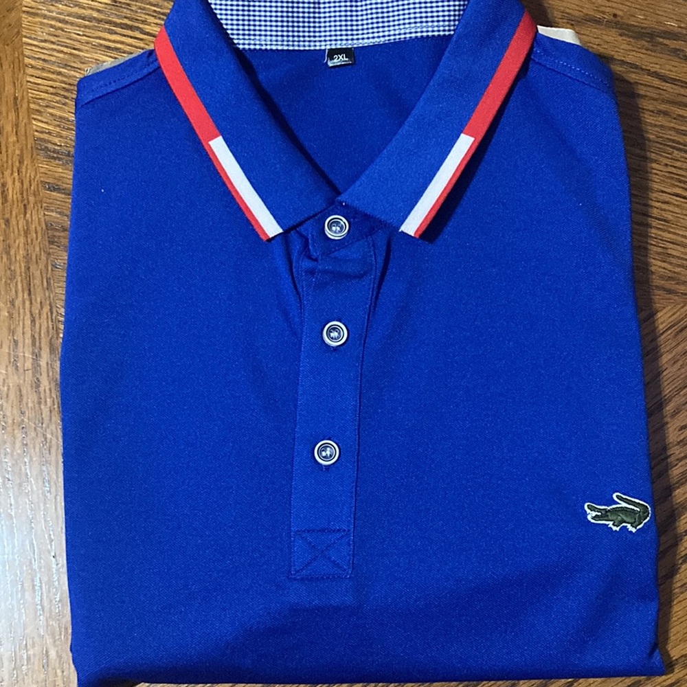 Blue blue polo shirt with red/white stripe.. - Picture 2 of 3